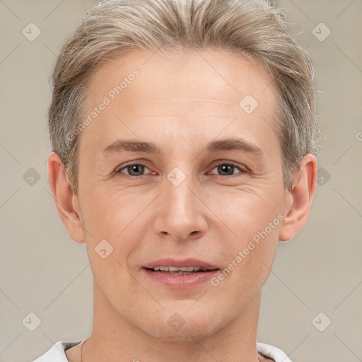 Joyful white adult male with short  brown hair and brown eyes