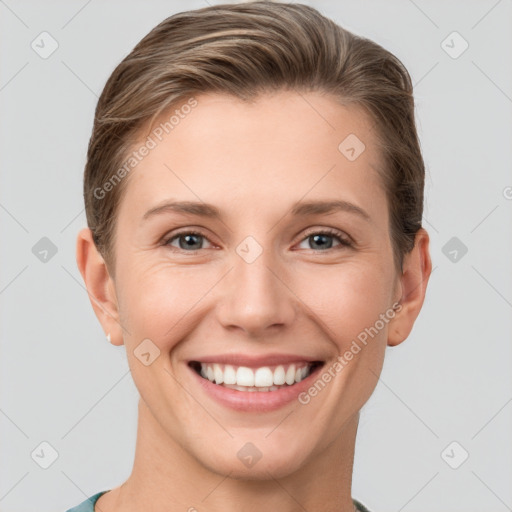 Joyful white young-adult female with short  brown hair and grey eyes