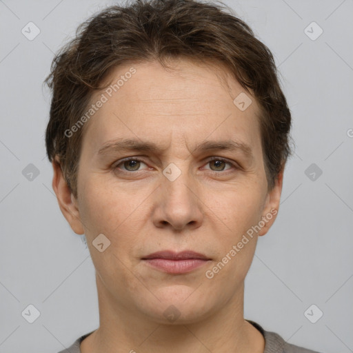 Joyful white adult female with short  brown hair and grey eyes