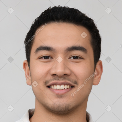 Joyful white young-adult male with short  black hair and brown eyes