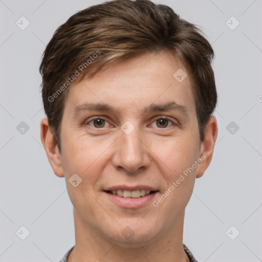 Joyful white adult male with short  brown hair and grey eyes