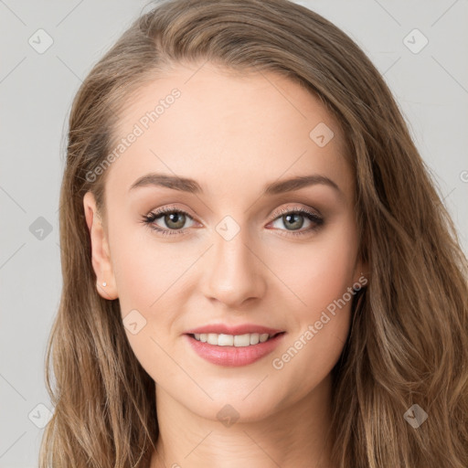 Joyful white young-adult female with long  brown hair and green eyes