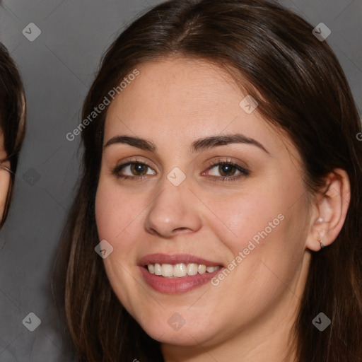 Joyful white young-adult female with long  brown hair and brown eyes