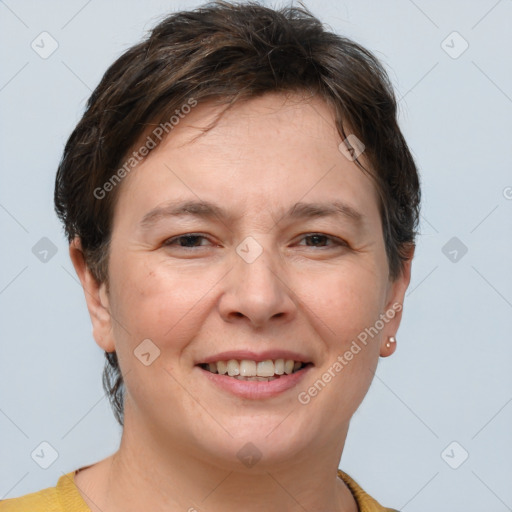 Joyful white adult female with short  brown hair and grey eyes