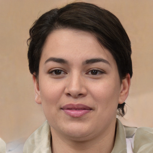 Joyful white young-adult female with medium  brown hair and brown eyes
