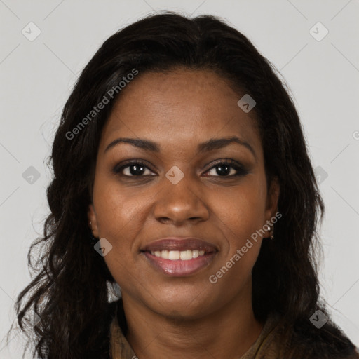 Joyful black young-adult female with long  brown hair and brown eyes