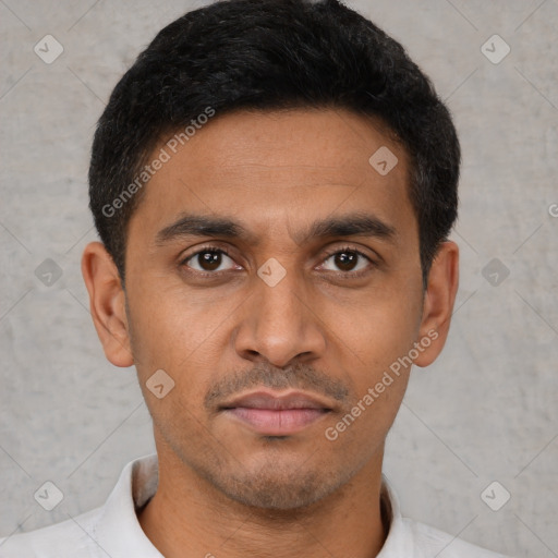 Joyful latino young-adult male with short  black hair and brown eyes