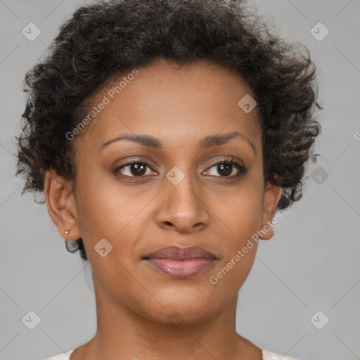 Joyful black young-adult female with short  brown hair and brown eyes