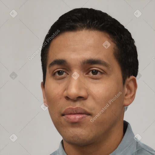 Neutral latino young-adult male with short  black hair and brown eyes