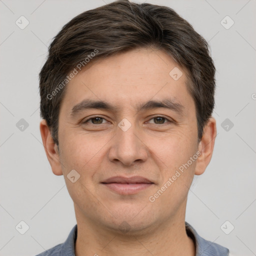 Joyful white adult male with short  brown hair and brown eyes