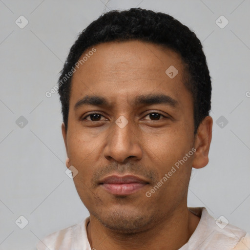 Neutral latino adult male with short  black hair and brown eyes