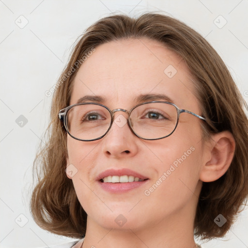 Joyful white young-adult female with medium  brown hair and blue eyes