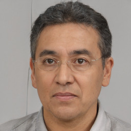 Joyful white middle-aged male with short  brown hair and brown eyes