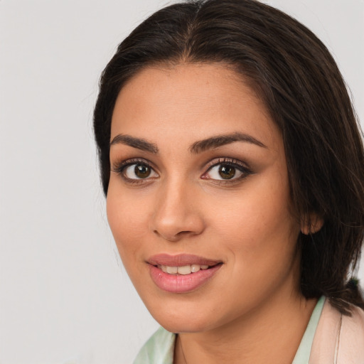 Joyful white young-adult female with medium  brown hair and brown eyes