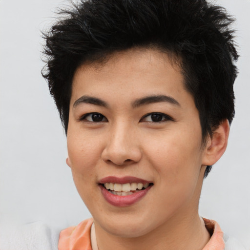 Joyful asian young-adult female with short  brown hair and brown eyes