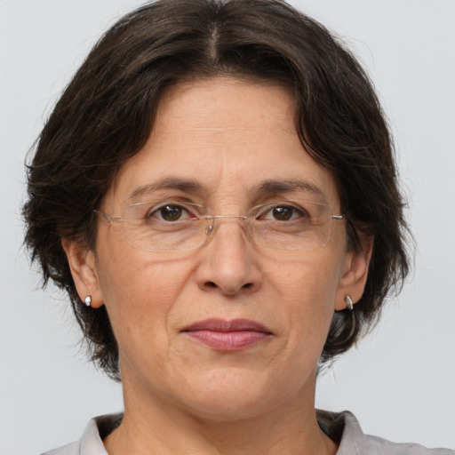 Joyful white middle-aged female with medium  brown hair and brown eyes