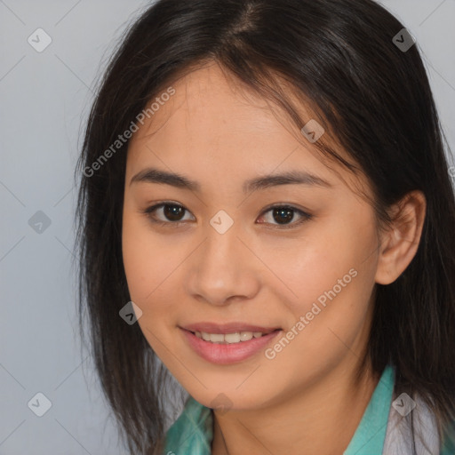 Joyful asian young-adult female with long  brown hair and brown eyes