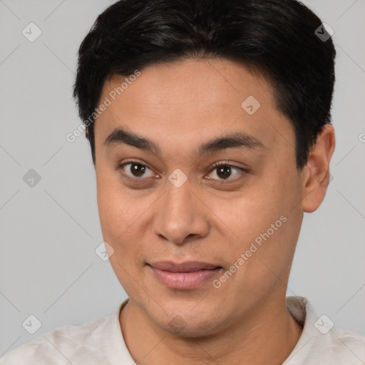 Joyful latino young-adult male with short  brown hair and brown eyes