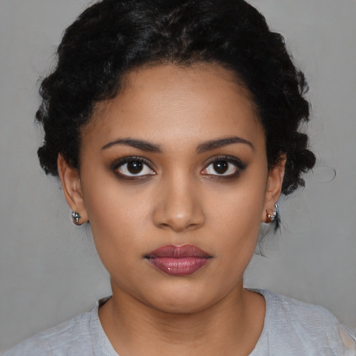 Neutral latino young-adult female with short  black hair and brown eyes