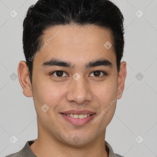 Joyful latino young-adult male with short  brown hair and brown eyes