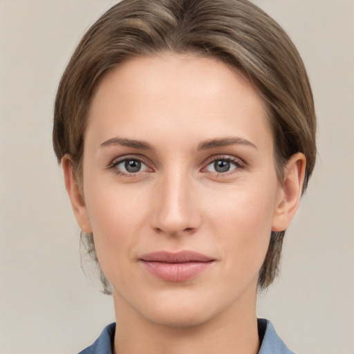 Joyful white young-adult female with medium  brown hair and grey eyes