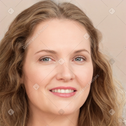 Joyful white young-adult female with long  brown hair and blue eyes