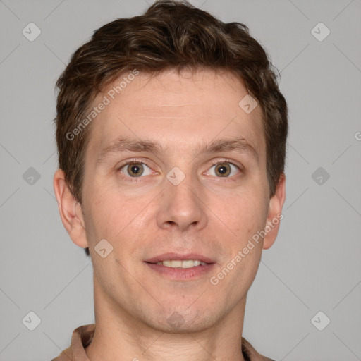 Joyful white adult male with short  brown hair and grey eyes