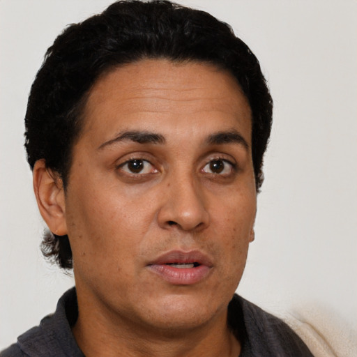 Neutral latino adult female with short  black hair and brown eyes
