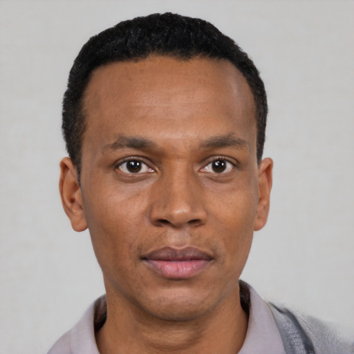 Neutral black young-adult male with short  black hair and brown eyes