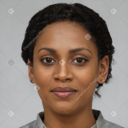 Joyful black young-adult female with short  black hair and brown eyes