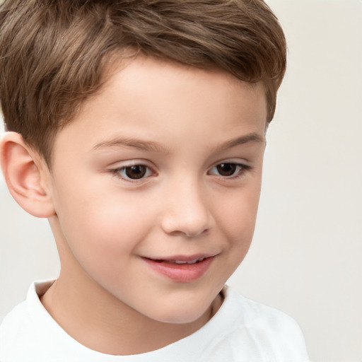 Joyful white child male with short  brown hair and brown eyes