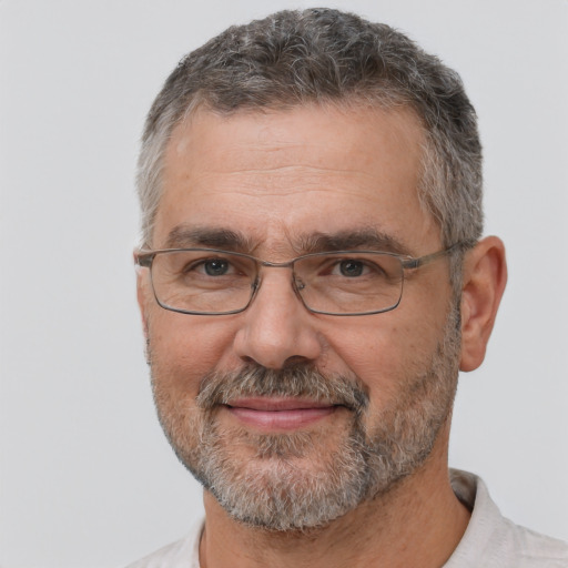 Joyful white middle-aged male with short  gray hair and brown eyes