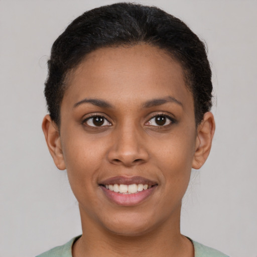 Joyful latino young-adult female with short  brown hair and brown eyes