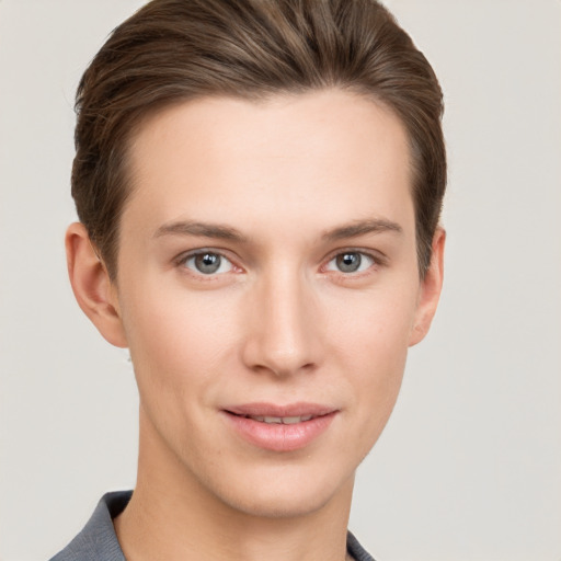 Joyful white young-adult female with short  brown hair and grey eyes