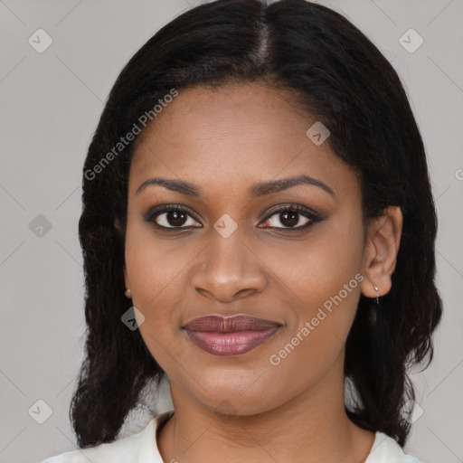 Joyful latino young-adult female with medium  brown hair and brown eyes