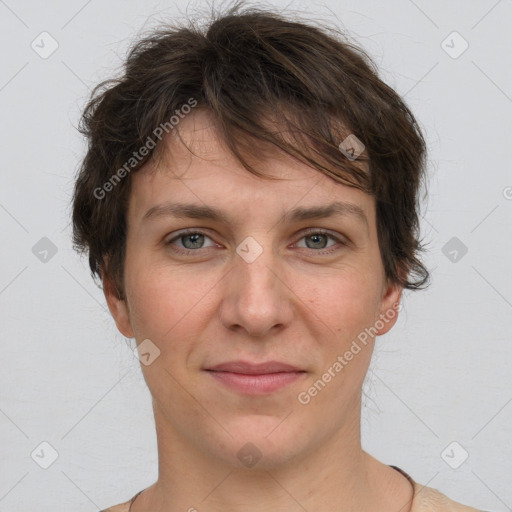 Joyful white adult female with short  brown hair and grey eyes