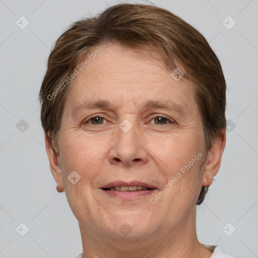 Joyful white adult female with short  brown hair and grey eyes