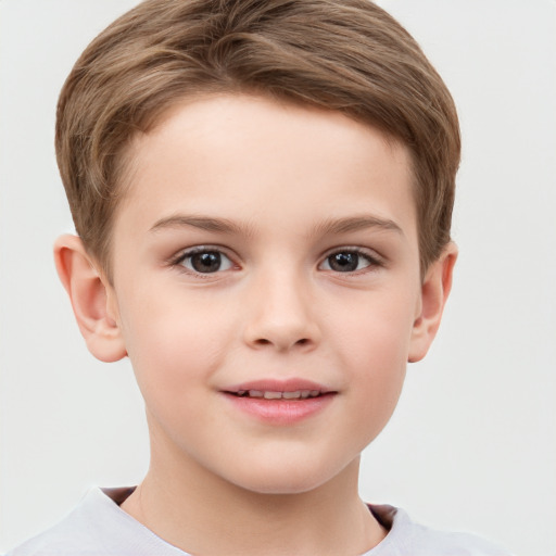 Joyful white child male with short  brown hair and brown eyes