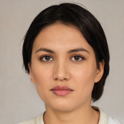 Neutral latino young-adult female with medium  black hair and brown eyes