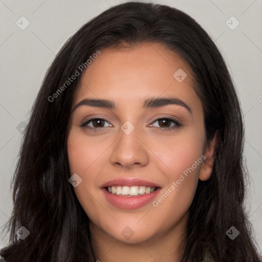 Joyful white young-adult female with long  black hair and brown eyes