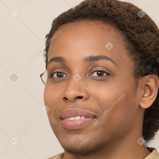 Joyful black young-adult female with short  brown hair and brown eyes