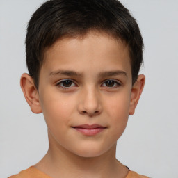 Joyful white child male with short  brown hair and brown eyes