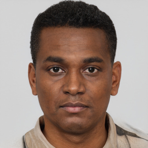 Neutral black young-adult male with short  black hair and brown eyes