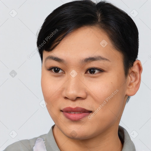 Joyful asian young-adult female with short  black hair and brown eyes