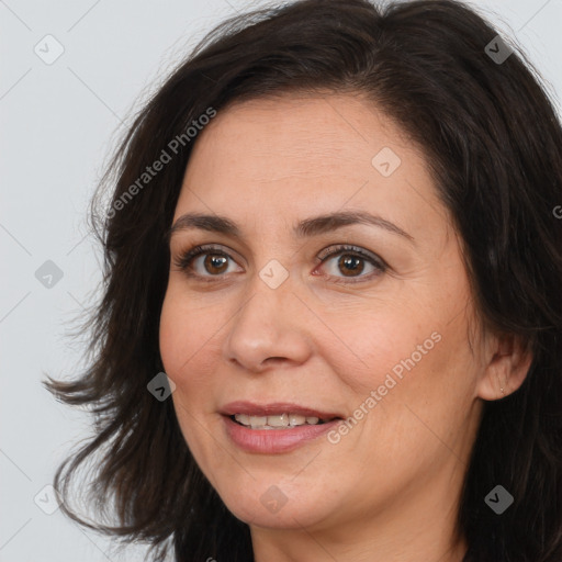 Joyful white adult female with medium  brown hair and brown eyes