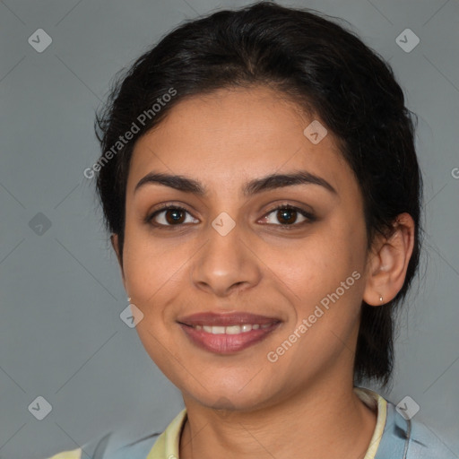 Joyful latino young-adult female with medium  brown hair and brown eyes