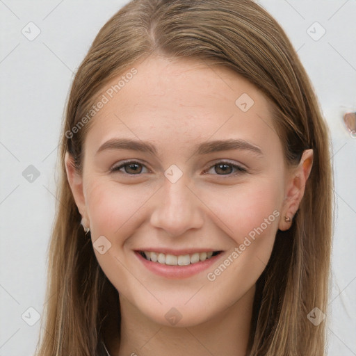 Joyful white young-adult female with long  brown hair and brown eyes