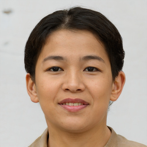Joyful asian young-adult female with short  brown hair and brown eyes