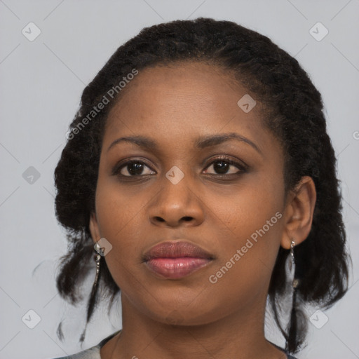 Joyful black young-adult female with medium  black hair and brown eyes