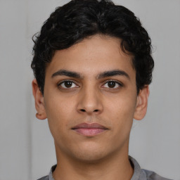 Neutral latino young-adult male with short  brown hair and brown eyes